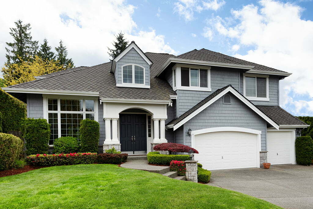 Home and healthy front yard during late spring season